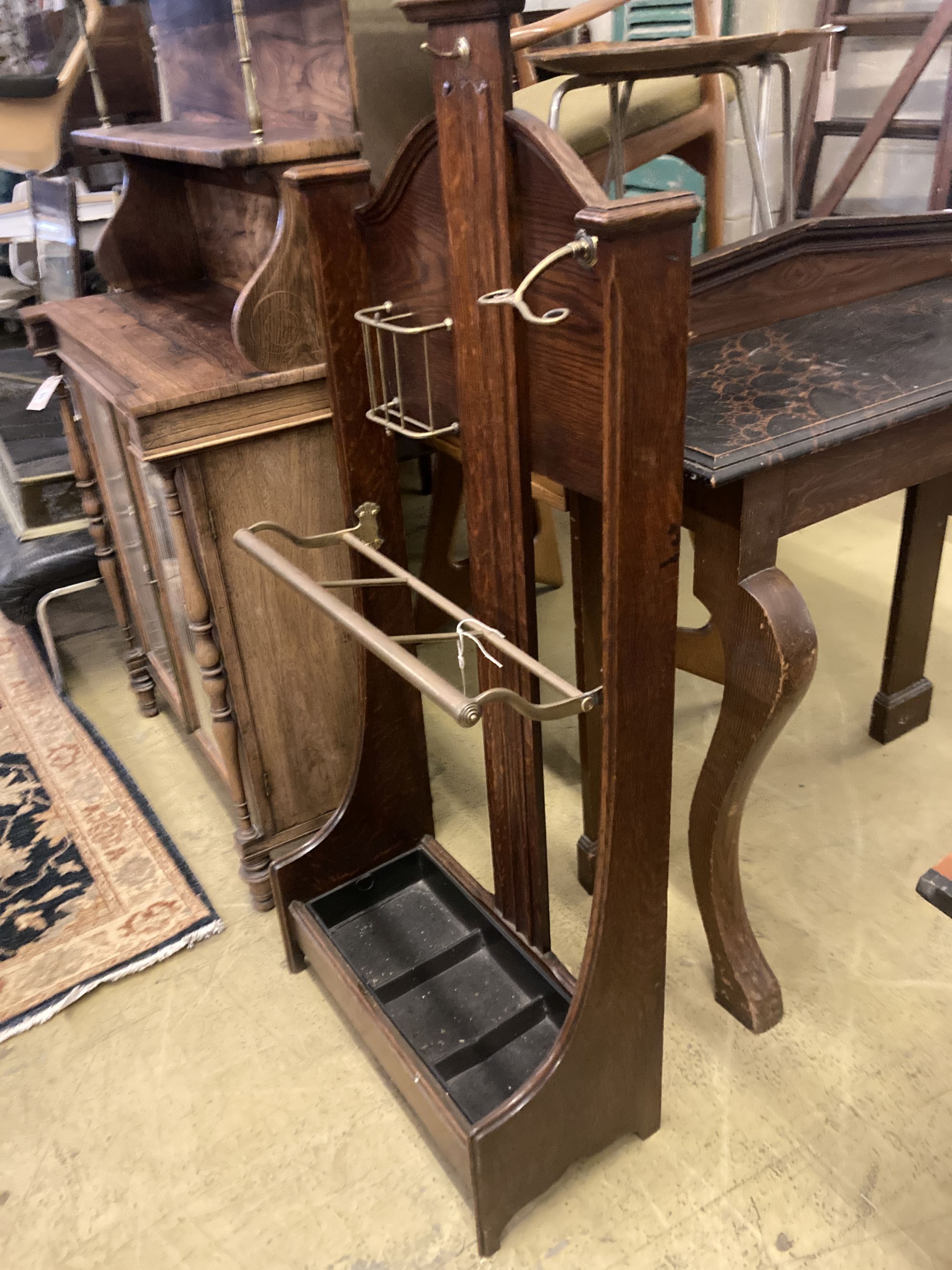 An early 20th century brass mounted oak hall stand, width 57cm depth 26cm height 130cm